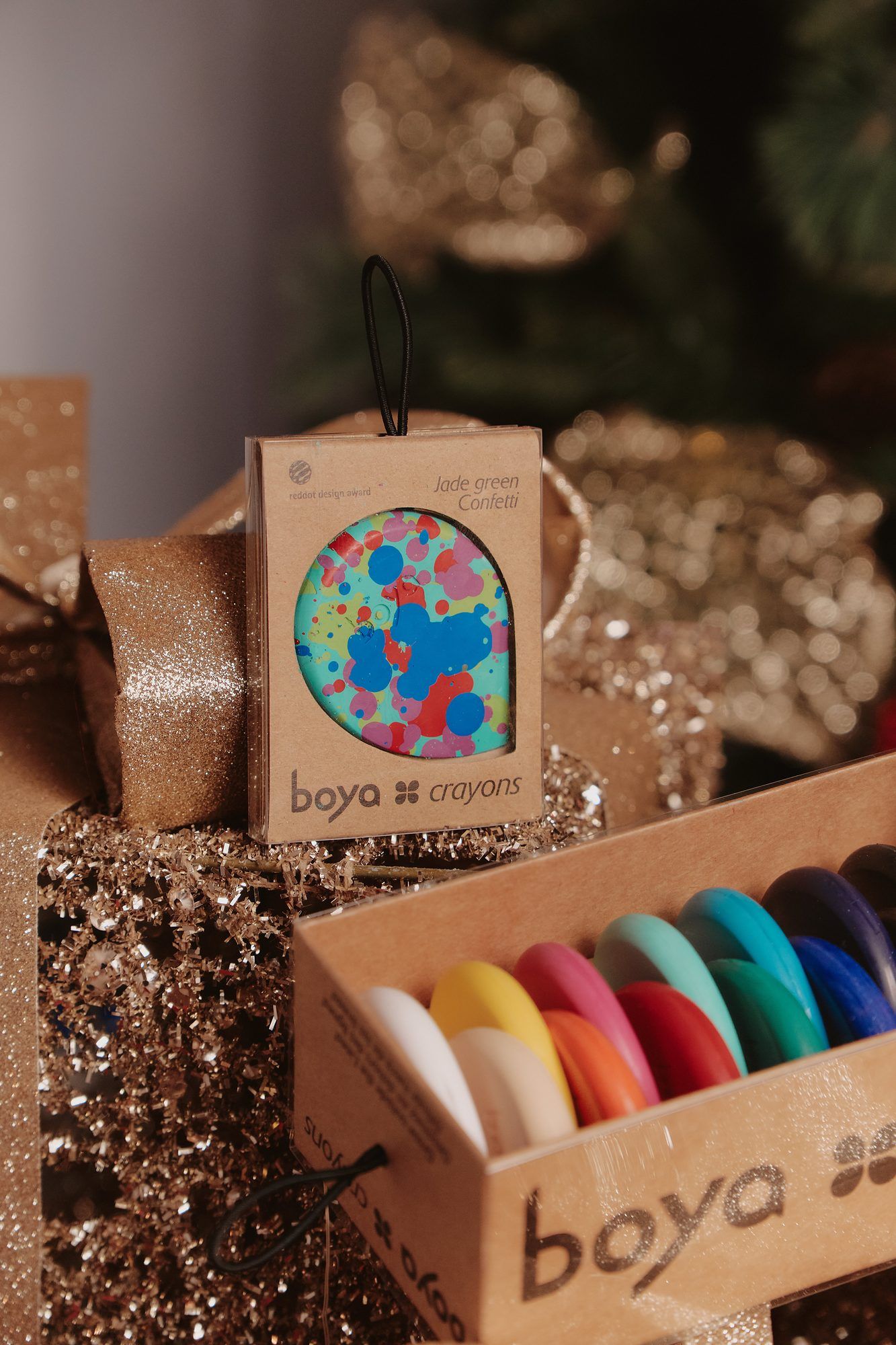 Boya: Boya crayon set in its box beside a festive ornament