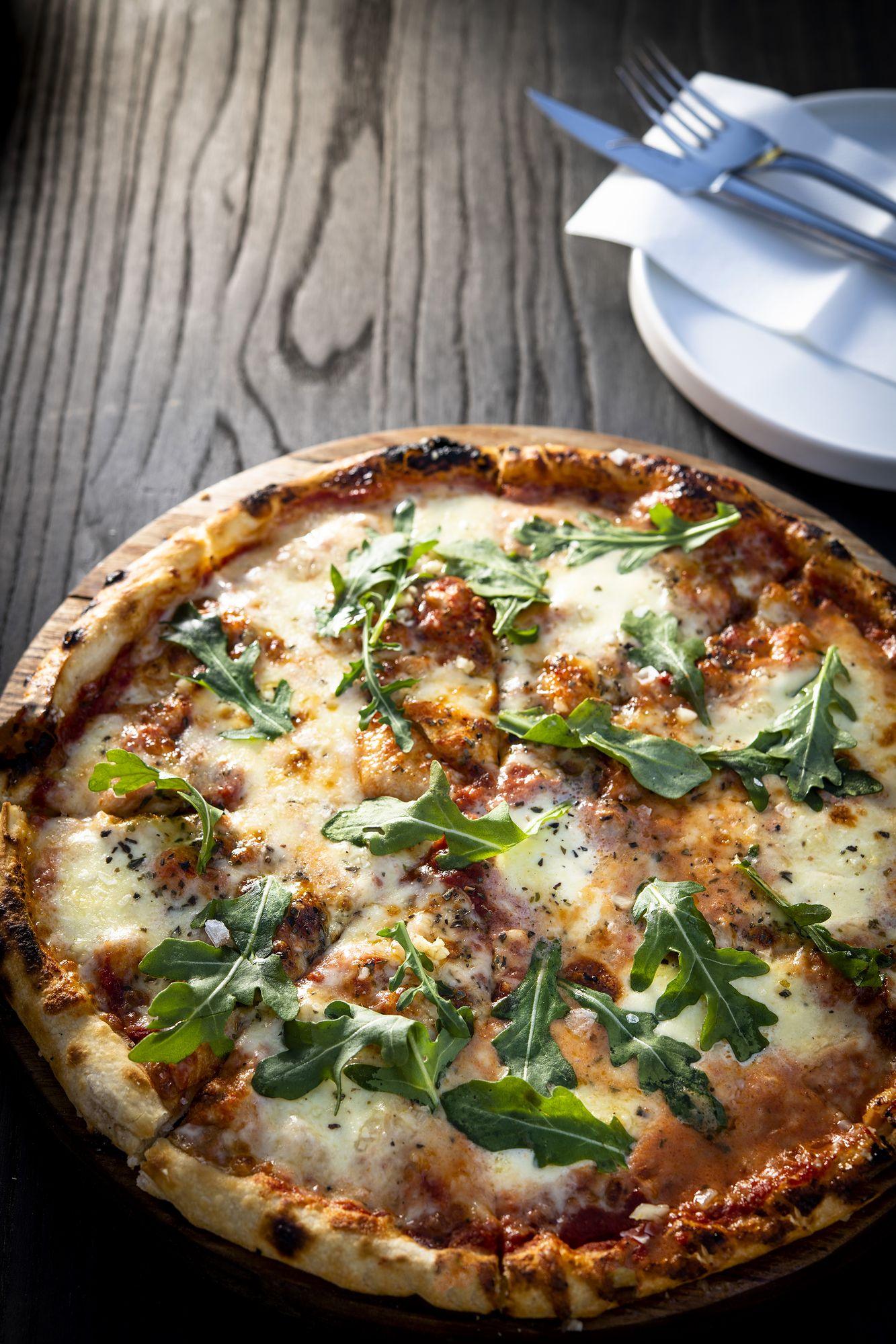 Double Dutch: Rocket-topped pizza on a wooden table