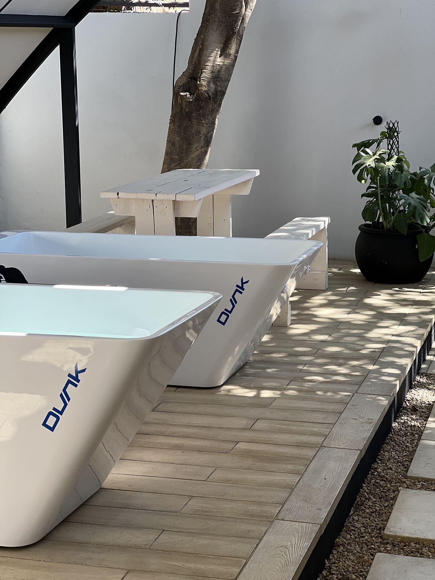 Dunk: White Dunk ice baths on a wooden deck