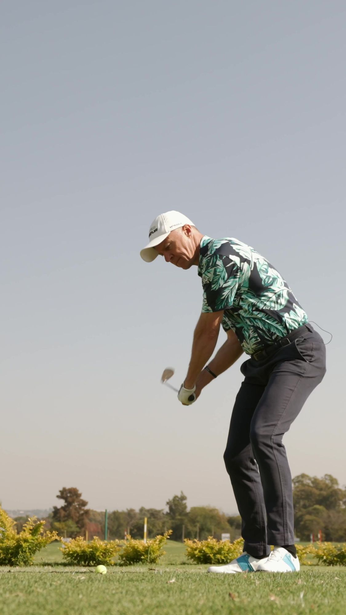 My Golf Pro: Golfer in a tropical-print shirt playing a lob shot
