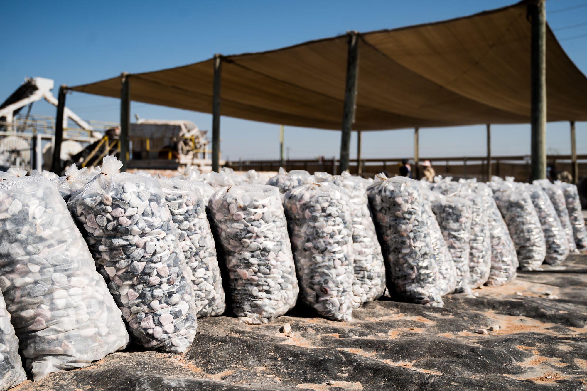 Pebble Africa: Row of filled pebble bags under shade netting
