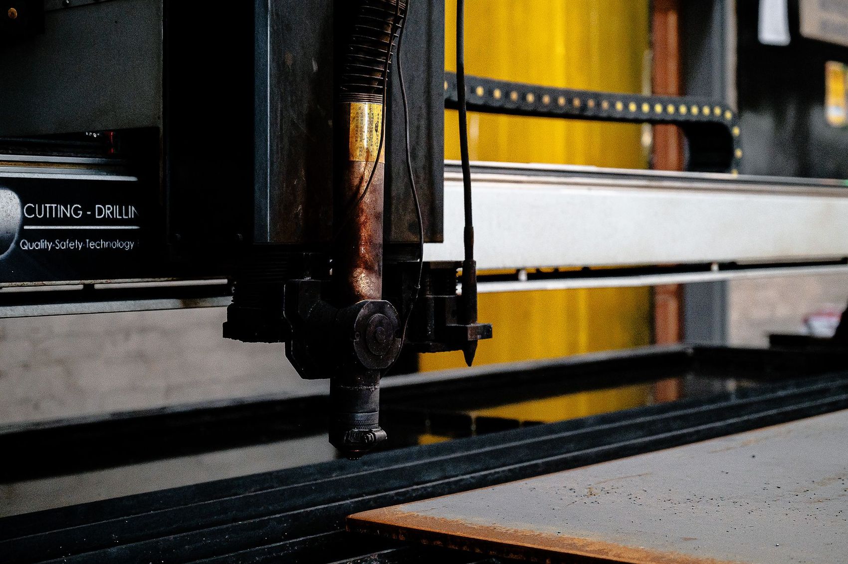 Q Tyres: Machinery detail in the workshop with yellow and blue fittings