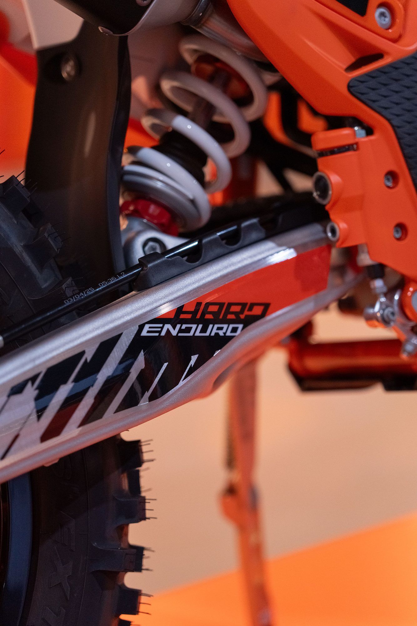 Raceworx: Close-up of the frame and rear shock on an orange enduro bike