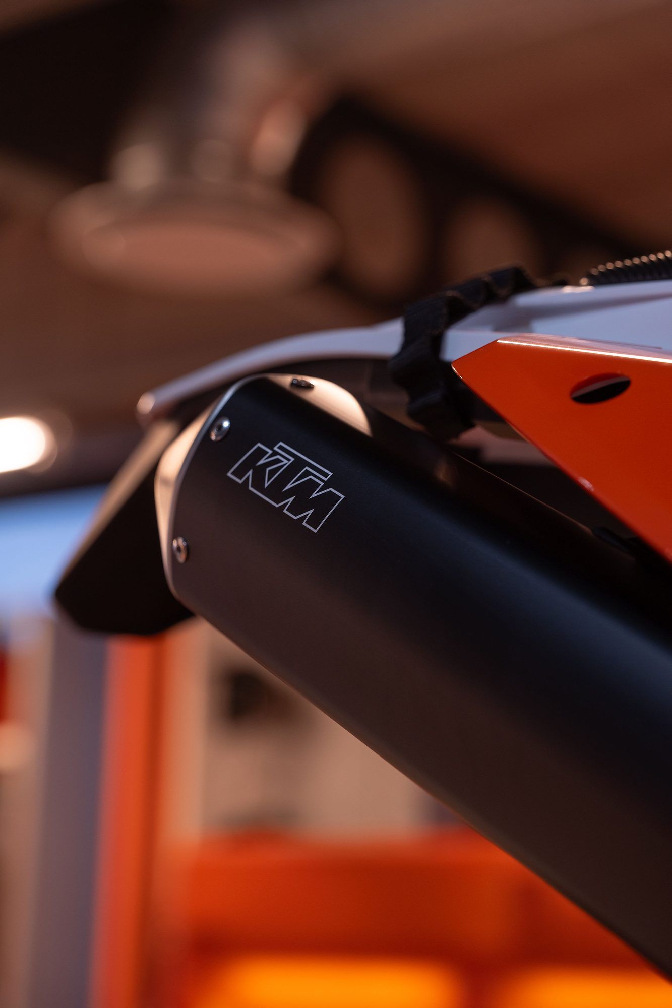 Raceworx: Close-up of a black exhaust with KTM branding